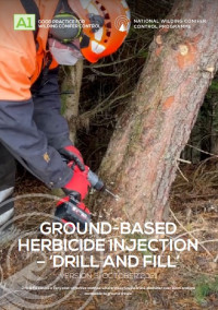 This image shows a wilding pine contractor wearing full PPE including helmet, earmuffs and facemask whilst drilling into the trunk of a wilding pine.